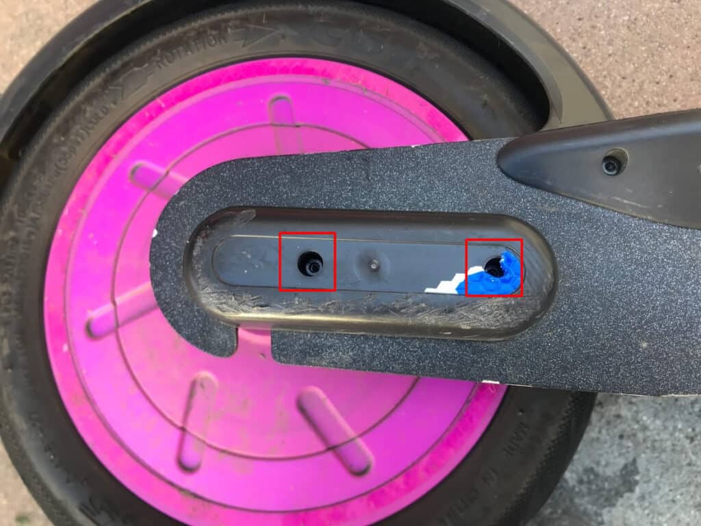 The rear wheel bolt guard screws.